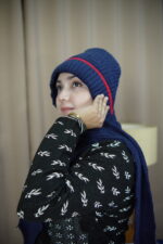 Blue Knit Beanie with Red Stripe – Bold Winter Comfort   লাল স্ট্রাইপসহ নীল নিট টুপি – সাহসী শীতকালীন আরাম